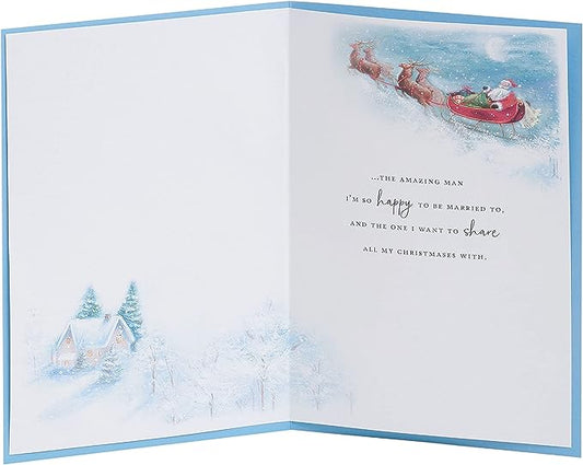 Festive husband Christmas greeting card featuring Santa and sleigh design by UK Greetings, ideal for holiday wishes.
