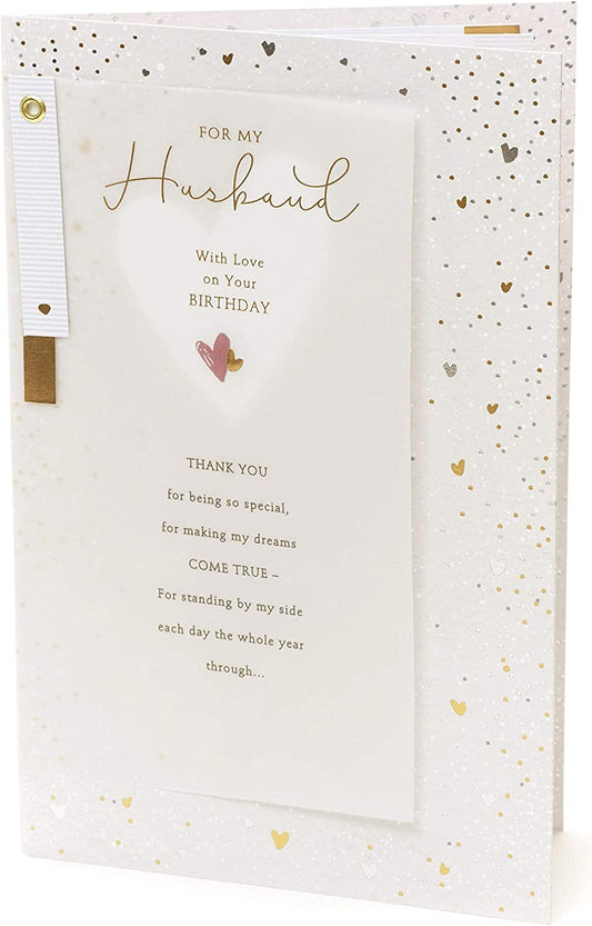 Front of UK Greetings Husband and Dad birthday greeting card with cheerful design and heartfelt message inside.