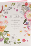 Colorful floral birthday greeting card from UK Greetings featuring a charming meadow design with cheerful flowers.