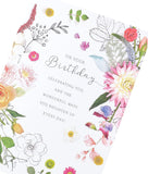 Cute floral birthday greeting card from UK Greetings featuring colorful meadow flowers and cheerful design.