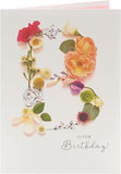 Into The Meadow female birthday greeting card by UK Greetings featuring floral design and cheerful message.