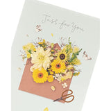 Colorful floral birthday greeting card from UK Greetings featuring vibrant flower illustrations and a heartfelt message inside.