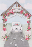 Laser-cut wedding car greeting card by UK Greetings featuring intricate floral and car designs on white cardstock.