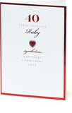 Luxury 40th Ruby Anniversary greeting card with a heart-shaped gem design from UK Greetings, featuring elegant red and gold accents.