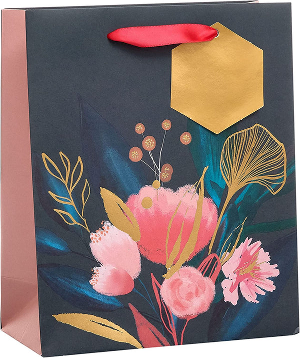 Medium floral gift bag with coordinating tag and greeting card from UK Greetings, featuring colorful floral design and decorative tag.