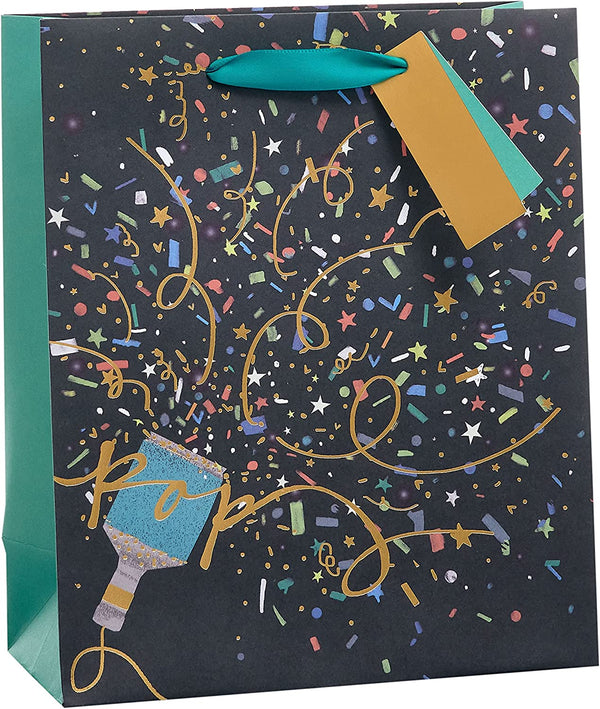 Medium UK Greetings party gift bag with attached tag, featuring festive design for gift packaging and celebration occasions.
