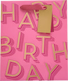 Medium pink UK Greetings gift bag with birthday lettering, featuring colorful design and handles.