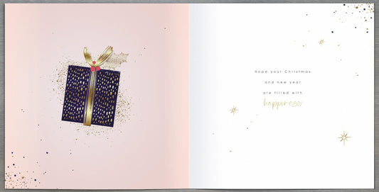 UK Greetings Christmas and New Year greeting card for sister featuring a midnight lustre design with festive holiday imagery.