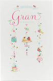 UK Greetings Mother's Day greeting card featuring a heartfelt message from a grandchild, decorated with floral and colorful design.