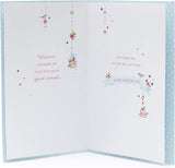 UK Greetings Mother's Day card featuring a heartfelt message from a grandchild, with colorful floral design and festive accents.