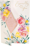 Beautiful floral design Mother's Day greeting card with envelope from UK Greetings, featuring vibrant flowers and elegant details.