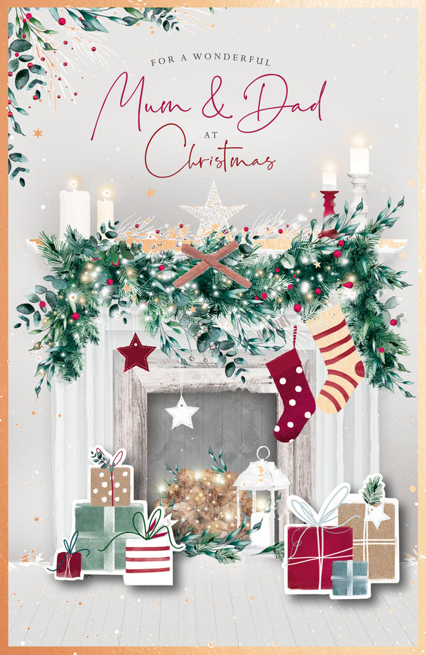 UK Greetings Mum and Dad fireplace Christmas greeting card with festive design for holiday wishes.
