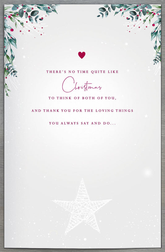 UK Greetings Mum and Dad fireplace Christmas greeting card featuring festive holiday design and warm holiday message.