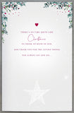UK Greetings Mum and Dad fireplace Christmas greeting card featuring festive holiday design and warm holiday message.