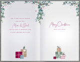 UK Greetings Mum and Dad fireplace Christmas greeting card with festive holiday design and heartfelt message.