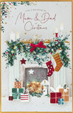 UK Greetings Christmas greeting card featuring a Mum and Dad fireplace scene, perfect for festive holiday wishes.