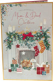 UK Greetings Mum and Dad Christmas greeting card featuring festive fireplace and presents, perfect for holiday wishes.
