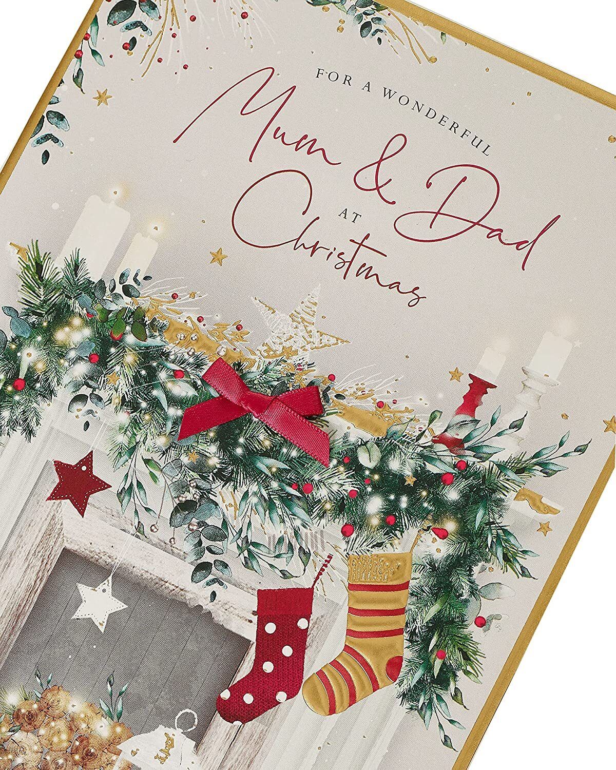 UK Greetings Mum and Dad fireplace-themed Christmas greeting card with festive design and heartfelt message, perfect for the holiday season.