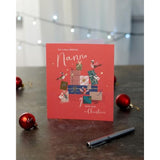 Nanna’s Magical Christmas greeting card featuring presents and gold wishes from UK Greetings, with festive holiday illustrations.