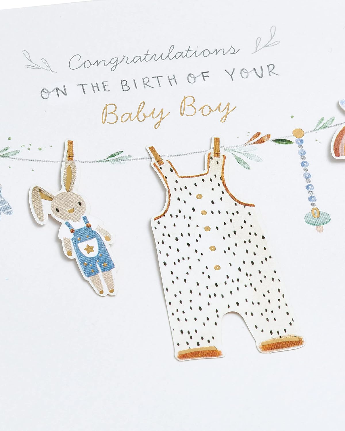 New baby boy greeting card featuring washing line design by UK Greetings, with colorful illustrations and cheerful message.