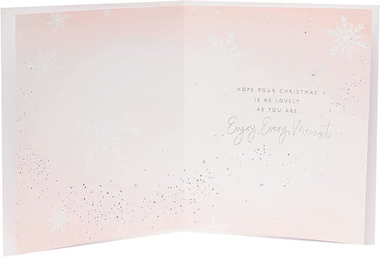 Niece Christmas greeting card featuring a charming chocolate girl design with foiled accents, by UK Greetings.