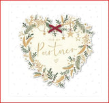 Decorative Christmas greeting card with a heart design from UK Greetings, featuring festive holiday artwork.