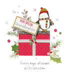 Penguin and present Christmas greeting card for granddaughter featuring festive holiday design by UK Greetings.