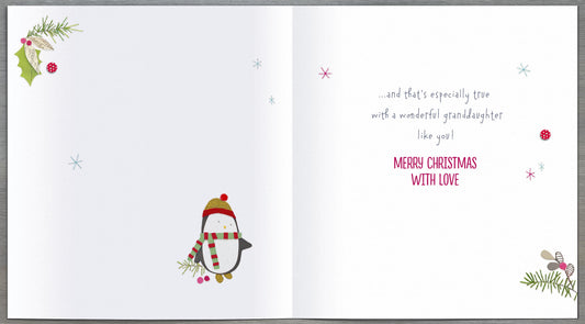 Penguin and present Christmas greeting card for granddaughter by UK Greetings featuring festive holiday design.