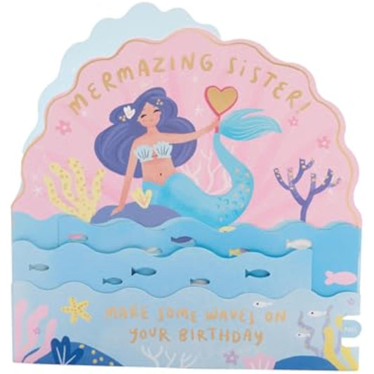 Colorful pop-up mermaid sister birthday greeting card by UK Greetings featuring vibrant ocean-themed design and festive elements.