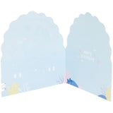 Colorful pop-up mermaid sister birthday card by UK Greetings featuring vibrant underwater scene and playful mermaid design.
