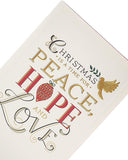 Religious Christmas greeting card with gold foil accents featuring a peaceful holiday message, by UK Greetings.