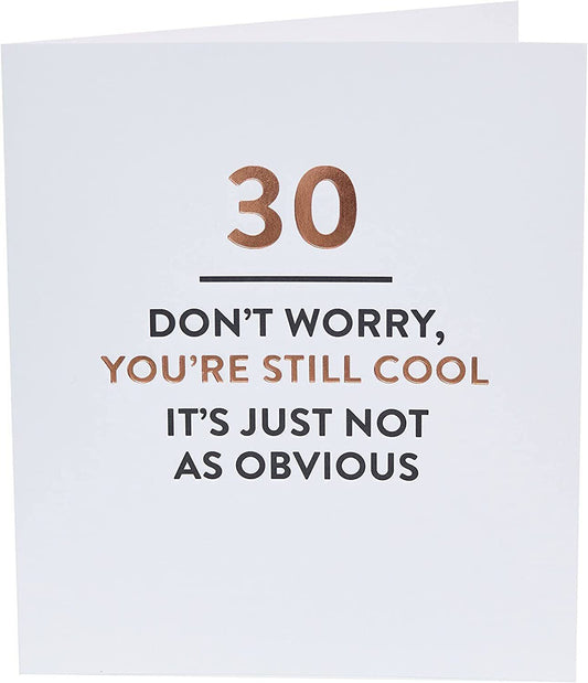 Sassy 30th Still Cool typography greeting card from UK Greetings with bold, colorful lettering on a white background.