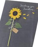 Bright sunflower design greeting card by UK Greetings featuring cheerful sunflower artwork on the front.