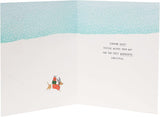 Festive Christmas greeting card featuring snow dogs across the miles, from UK Greetings, with holiday-themed snowy landscape and dogs.