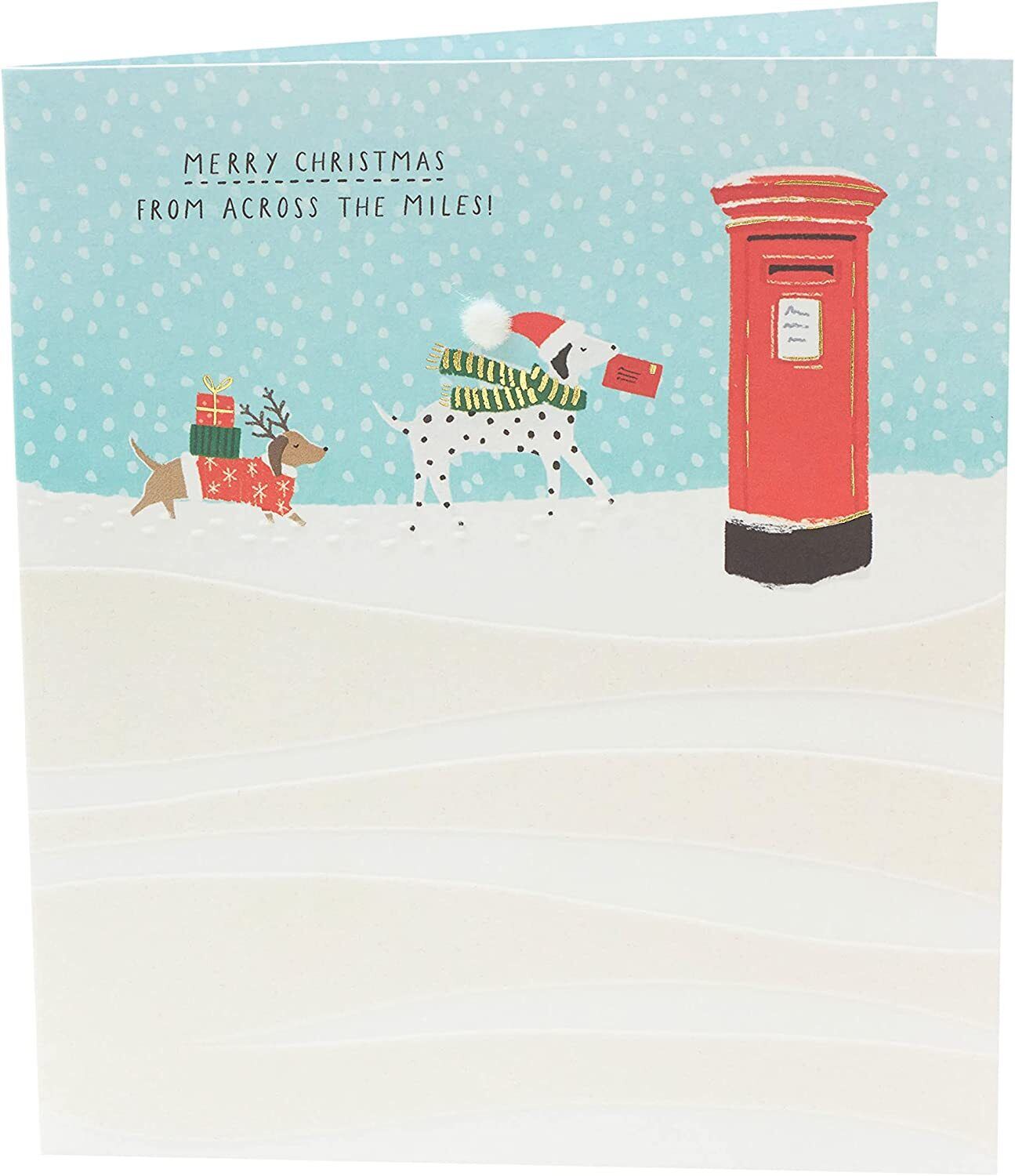 Festive Christmas greeting card featuring Snow Dogs Across the Miles design by UK Greetings, with holiday-themed artwork and cheerful imagery.
