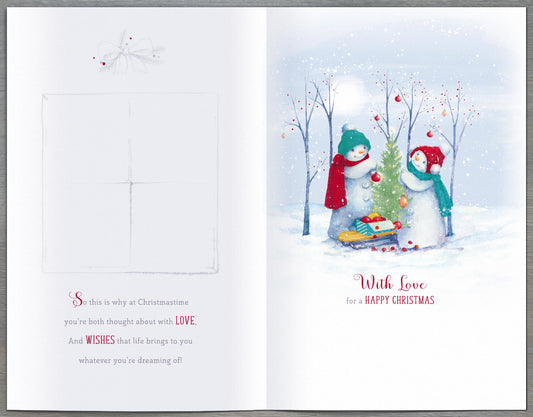 Christmas greeting card featuring snowmen for daughter and son-in-law, UK Greetings, with festive holiday design and cheerful imagery.