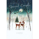 Beautiful greeting card by UK Greetings featuring a reindeer in the snow with a festive "Happy Christmas" message for couples.