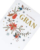 Hand-finished Christmas greeting card with floral embroidery design by UK Greetings, featuring detailed festive embroidery on cardstock.