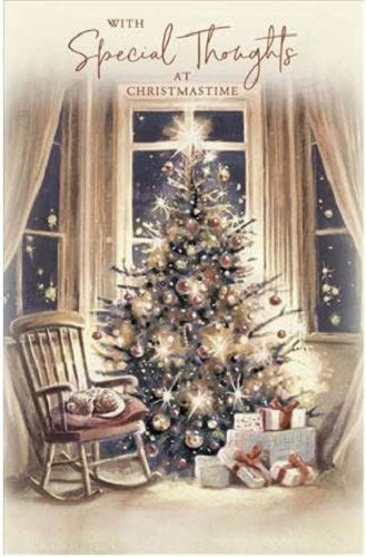 Christmas greeting card featuring a tree and cat design from UK Greetings, with festive holiday artwork on the front.