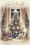 Christmas greeting card featuring a tree and cat design from UK Greetings, with festive holiday artwork on the front.