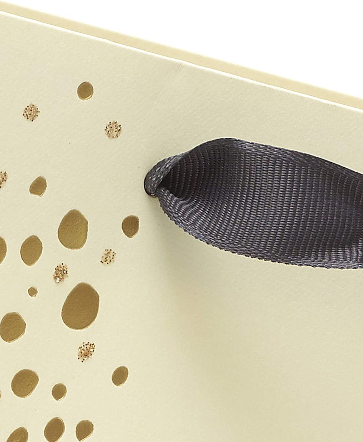 Festive chic large gift bag with cocktail design, perfect for special occasions, featuring UK Greetings branding.