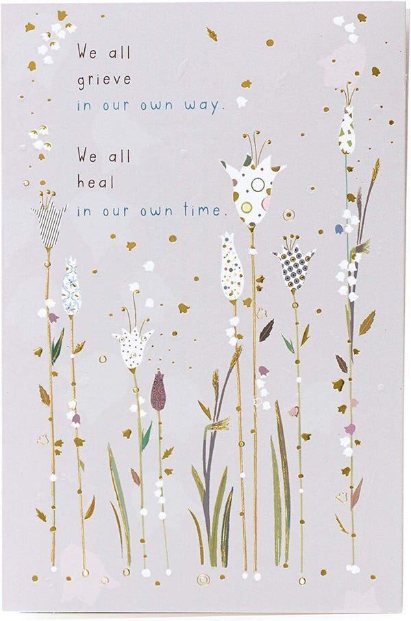 Gold foil sympathy greeting card titled "Caring Thoughts" by UK Greetings, featuring comforting design and heartfelt message.