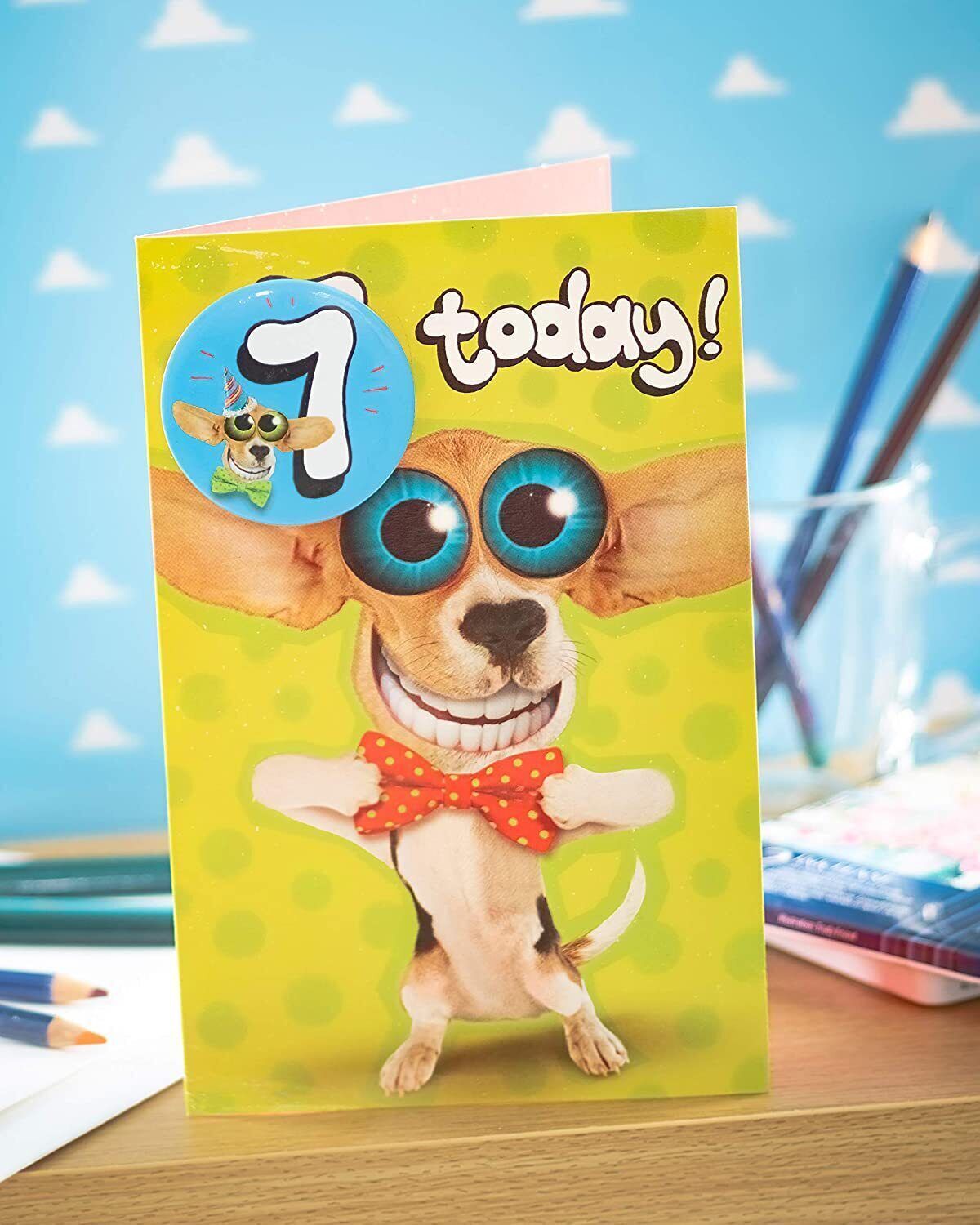 Colorful Wacky Big-Eyes Dog 7th Birthday greeting card by UK Greetings, featuring a playful dog illustration and festive design.