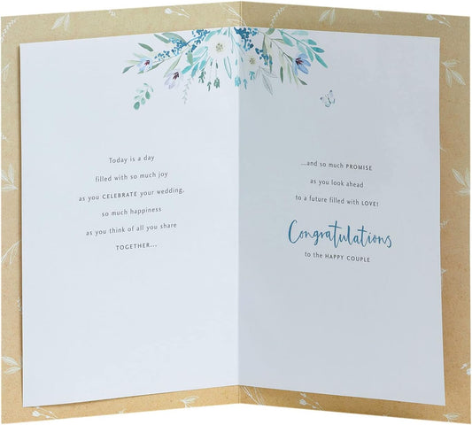White wedding greeting card with floral design for him, her, or friends, by UK Greetings, featuring elegant flower artwork.
