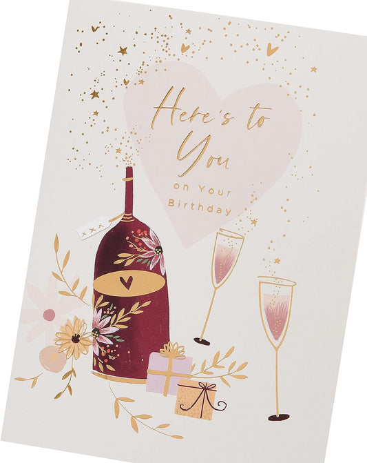 UK Greetings birthday greeting card with wine bottle, glasses, and presents, perfect for celebrating special occasions.