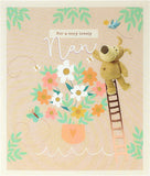 Cute Boofle on ladder birthday greeting card from UK Greetings, featuring adorable cartoon dog with colorful background.