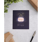 UKG birthday greeting card for her featuring a starry cake design and an envelope, perfect for celebrating special occasions.