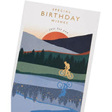 Birthday greeting card for him featuring a cyclist and sunset with gold foil accents, from UKG.