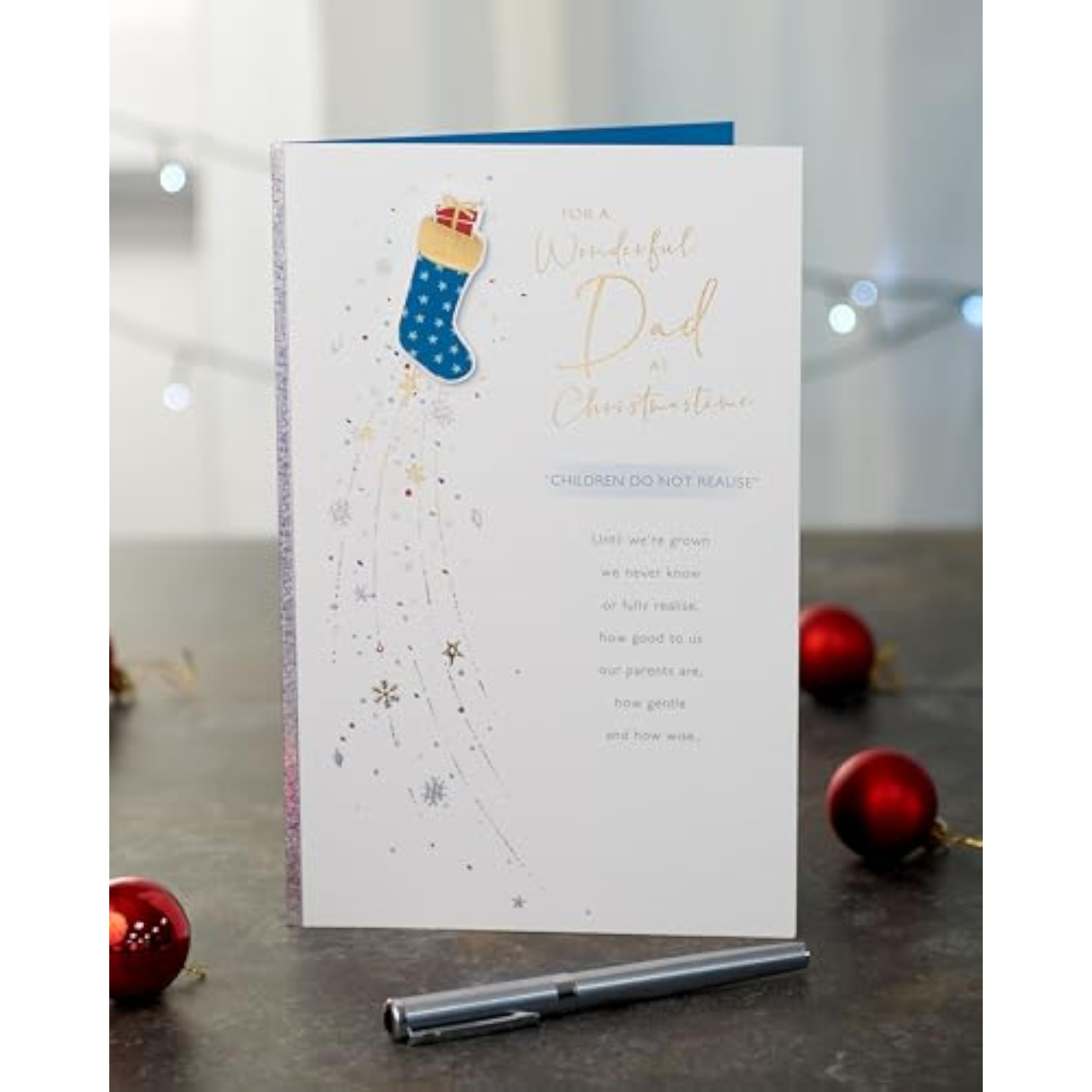 Blue Christmas greeting card for dad with foil and embossed stocking design, UKG brand, festive and decorative.