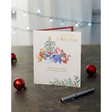 Disney Winnie the Pooh Christmas greeting card featuring Pooh and friends with a festive foil design, perfect for holiday wishes.